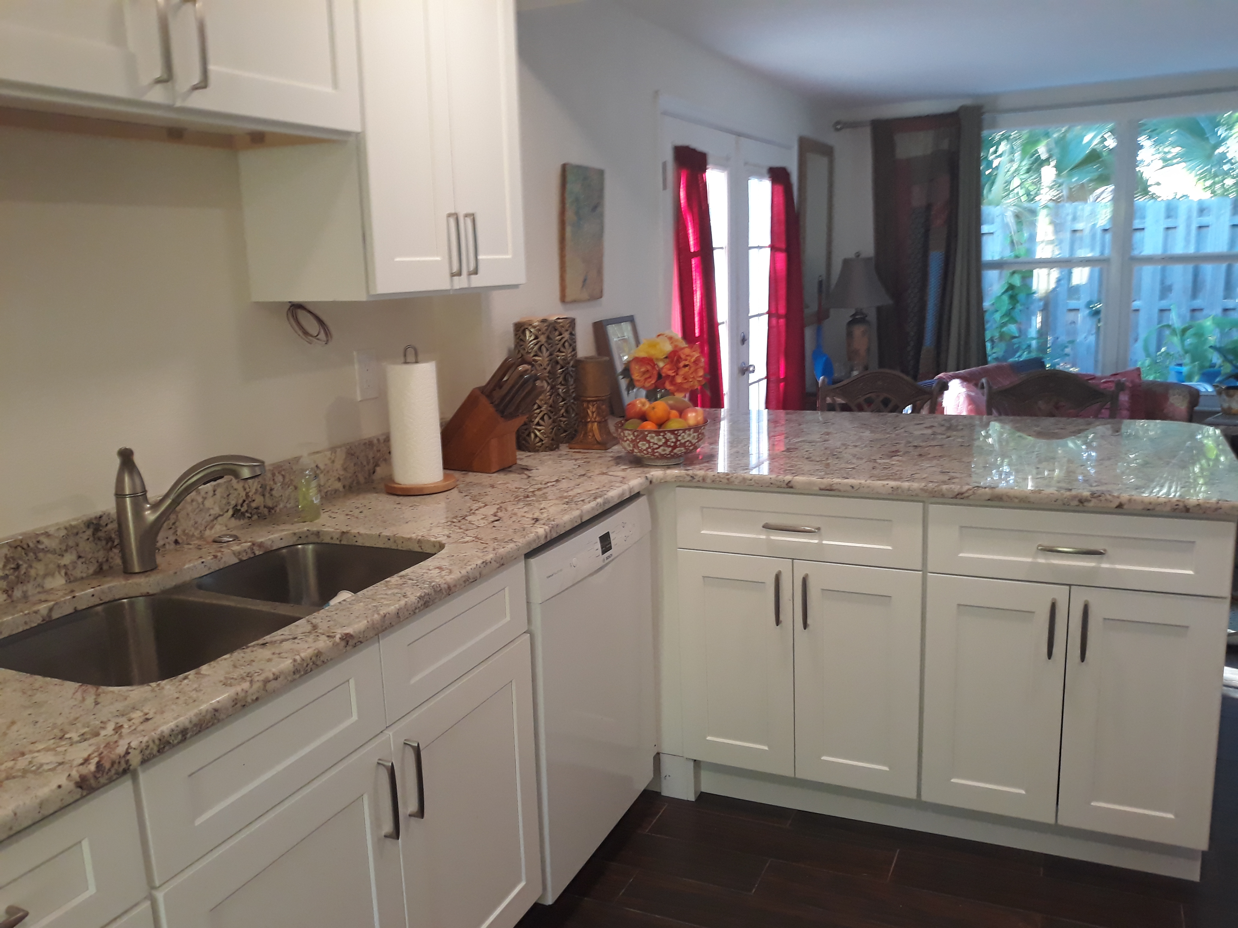 Double sink and dishwasher with plenty of cabinet space.